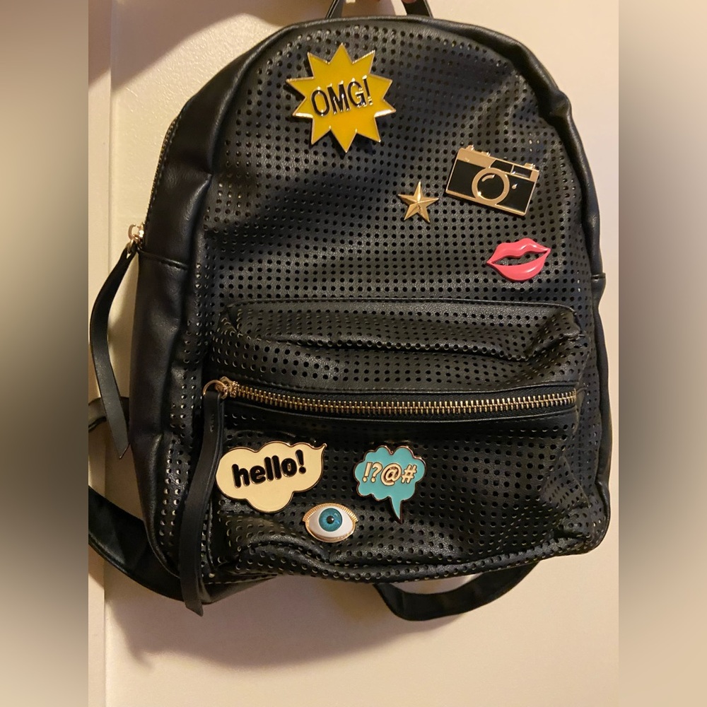 Backpack with enamel pins